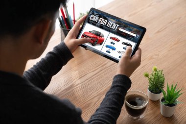 car rental website on computer screen for tourist to rent a car for transportation snugly