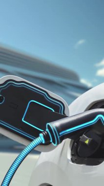 Modern ve fütüristik bina arka planında akıllı EV şarj istasyonundan elektrikli araba şarj oluyor. Alternatif ve sürdürülebilir enerji kullanan şarj edilebilir EV arabaların teknolojik gelişimi. İnceleyin