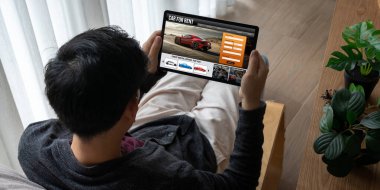 car rental website on computer screen for tourist to rent a car for transportation snugly