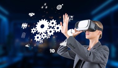 Profesyonel bir kadın, yenilik ve işbirliğini sembolize eden modern ofis ortamında sanal gerçeklik teknolojisi, takım çalışması ve ağ kurma fırsatları sergiliyor. XDMCP