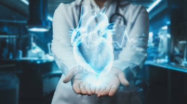 Hastanede kalp anatomisi hologramını tutan profesyonel doktorlara yakın çekim. Teknoloji yeniliklerini kullanarak kalp ameliyatına hazırlanan zeki bir tıp çalışanı. Kardiyoloji. İyileştirici.