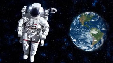 Astronot uzay yürüyüşü yaparken uzay istasyonunda uzay uçuşları yapıyor. Astronot operasyon için tam uzay kıyafeti giyiyor. Bu görüntünün elementleri NASA astronot fotoğraflarıyla donatılmıştır. .