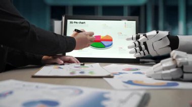 Çağdaş bir ofiste, vizyoner bir danışman AI ile saf veri içgörüleri, yenilikçi pazarlama yollarını ortaya çıkarmak ve genel iş etkisini artırmak için aynı hizaya gelir. Noogenesis Yapay Zeka