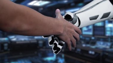 Bu video yapay zeka kavramını gözler önüne seriyor. Veri simgeleriyle dolu yüksek teknolojili bir arkaplanda robot kola uzanan bir insan eli görülüyor. Auvana