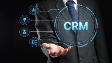 Modern bir işadamı, iş stratejisi ve büyümedeki teknoloji rolünü vurgulayarak, yenilikçi dijital grafikler yoluyla müşteri ilişkileri yönetimi kavramını sergiliyor. XDMCP