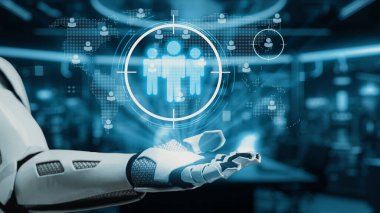 Modern bir çalışma alanında yenilik ve teknolojiyi ön plana çıkaran, kullanıcı simgeleri ve hedef grafiklerin yer aldığı dijital arayüzle gelecekçi bir robotik kol etkileşim halindedir. Auvana