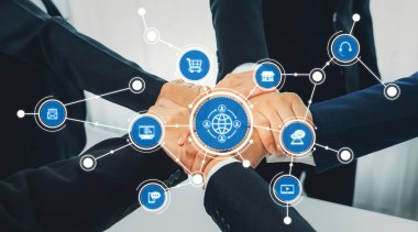 İş dünyasındaki işbirliğinin ve bağlanabilirliğin görsel bir temsili, küresel ortaklıkları ve modern teknoloji etkileşimlerini sembolize eden ikonlarla bir araya gelen elleri gösteren. Dostluk