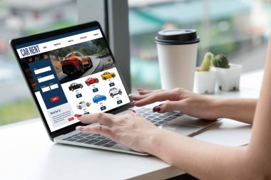 car rental website on computer screen for tourist to rent a car for transportation snugly
