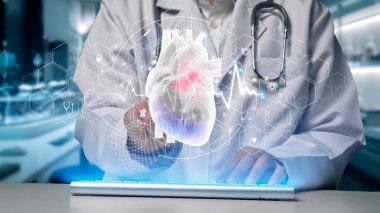 Klavye yazan ve insan kalbi anatomisini gösteren yetenekli doktorlara yaklaş. Kalp ameliyatına hazırlanırken sağlık çalışanı kalp rahatsızlığını araştırıyor ve inceliyor. Teknoloji. İyileştirici.