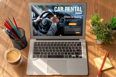 car rental website on computer screen for tourist to rent a car for transportation snugly
