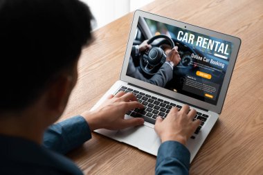 car rental website on computer screen for tourist to rent a car for transportation snugly