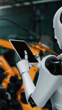 Cybernated industry robot and robotic arms for assembly in factory production . Concept of artificial intelligence for industrial revolution and automation manufacturing process .