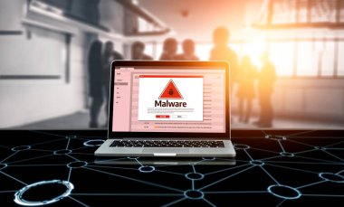 Cyber attacking concept. Malware alert showing on computer screen display scam and threat detection on computer system or online server to be removed snugly.