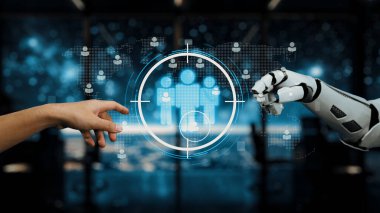 İnsan eliyle robot eli arasındaki işbirliğini gösteren büyüleyici bir görüntü, iş yerindeki teknoloji ve yeniliğin geleceğini sembolize ediyor. Auvana