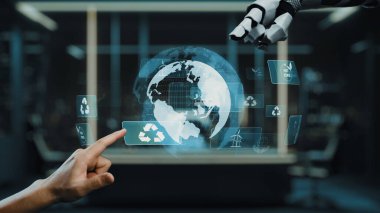 Bir insan eli ve robotik el, teknoloji ve çevre sorumluluğu arasındaki sinerjiyi sembolize eden holografik geri dönüşüm sembolleriyle uğraşır. Auvana