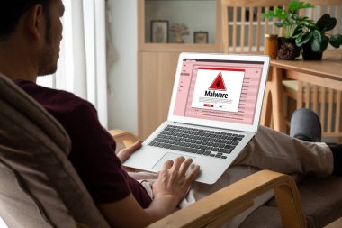 Cyber attacking concept. Malware alert showing on computer screen display scam and threat detection on computer system or online server to be removed snugly.