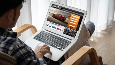 car rental website on computer screen for tourist to rent a car for transportation snugly