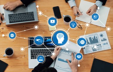 Ortak bir toplantıda, modern bir çalışma alanı içindeki çeşitli grafikler, grafikler ve teknoloji araçlarıyla birlikte yenilikçi tartışmaları ve stratejileri kolaylaştıran yapay zeka ilerlemeleri ele alındı. Dostluk