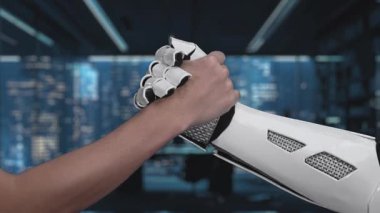 Bir insan eli robotik bir elle birleşmek için uzanıyor, işbirliğine olan bağlılığını vurguluyor, gelecekteki bir ortamda dijital bir işaretle destekleniyor. Auvana