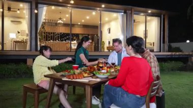 Family together for holiday celebration in garden. Family member gather have dinner. Outdoor picnic activity to relax with food and spend time with cute relatives cross generation gap. Divergence.