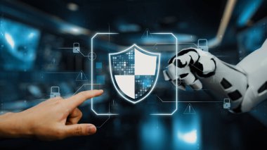 Bir insansı robot el ve bir insan eli, gelişmiş siber güvenlik önlemleri ve teknolojik koruma stratejilerini sembolize eden parıldayan bir dijital güvenlik kalkanıyla etkileşim halindedir. Auvana
