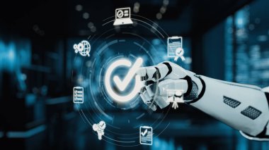 Fütürist bir robot el, modern bir iş ortamında teknoloji ve verileri temsil eden dijital simgelerle uğraşır. Bu görüntü otomasyonu ve yeniliği sembolize ediyor. Auvana