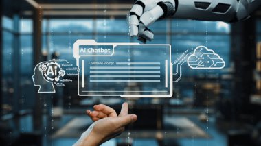 Bir robot el, dijital çağdaki teknoloji ve insan etkileşimini sembolize eden, gösterişli bir ofiste yapay zeka sohbet robotu arayüzü ile etkileşime giriyor. Auvana