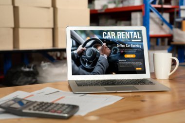 car rental website on computer screen for tourist to rent a car for transportation snugly