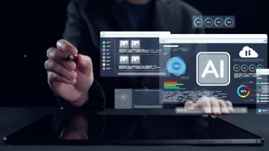 Bir elin dijital ekoloji sembolleriyle etkileşime girdiği, rüzgar türbinleri ve bataryalar gibi yenilenebilir enerji simgelerini karanlık bir zemine karşı sergileyen kavramsal bir görüntü. Dörtgen