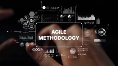 Hands Typing on Keyboard with Agile Methodology Concept and Data Visualizations on Screen. Asymptotic smart data analytic.