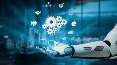 Fütürist robot bir el dijital çağda yenilik ve verimliliği sembolize ederek modern ofis alanında iş ve teknolojiyi temsil eden dijital ikonlar tutuyor. Auvana