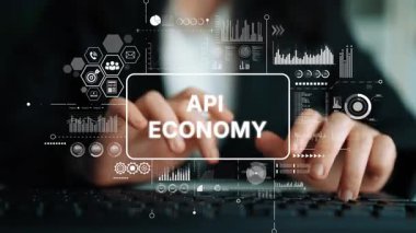 Modern İş Dünyası 'nda API Ekonomi ve Veri Analizi' ni temsil eden Dijital Kaplamalı Eller Klavyede Yazıyor. Asemptotik akıllı veri analitiği.