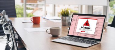 Cyber attacking concept. Malware alert showing on computer screen display scam and threat detection on computer system or online server to be removed snugly.