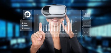 Bir iş kadını, veri analizlerini görselleştirmek, finansal planlama ve pazarlama stratejisini yenilikçi teknolojiyle geliştirmek için sanal gerçeklik kulaklığı takar. XDMCP