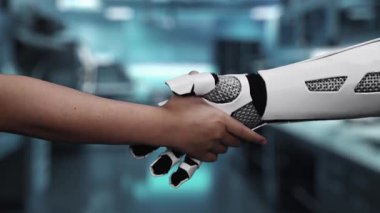 Bulanık laboratuarda yüzen DNA hologramıyla el sıkışmak için insan ve beyaz robotik ele uzanıyor. İnsan ve yapay zeka, semptomları analiz etmek ve teşhis etmek için birlikte çalışıyorlar. Sağlıklı..