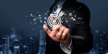 Bir iş adamı çevrimiçi pazarlama stratejilerini hedeflemek için dijital araçlar kullanır. Bu resim, kampanya başarısı için AI ve pazarlamanın kesişimini gösteriyor. XDMCP