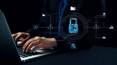 Şık bir dizüstü bilgisayar, modern bir çalışma ortamında güçlü siber güvenlik önlemleri ve veri koruma stratejilerini sembolize eden canlı bir dijital kilit sergiliyor. Dörtgen