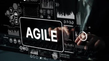 Eller klavyede, iş yönetiminde teknoloji ve yeniliği temsil eden çevik çerçeve görselleri ve dijital grafiklerle yazı yazıyor. Asemptotik akıllı veri analitiği.