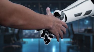 Fütüristik bir dekor bir insan eli ve bir robot eli gösteriyor. Işıldayan bir rokete işaret ederler, iş dünyasındaki yeniliği ve büyümeyi simgelerler. Auvana