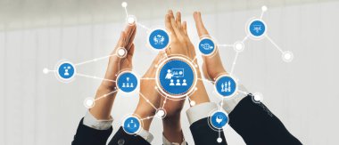 İşbirliği ve takım çalışmasının görsel bir temsili, profesyonel bir iş ortamında birlik ve bağlantıyı belirtmek için bir araya gelen gösterişli eller. Dostluk