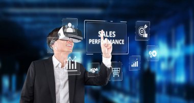 Sanal gerçeklik teknolojisini kullanarak satış performansını ve pazarlama analitiğini geliştiren bir iş adamı, veri görselleriyle dolu modern bir dijital çalışma alanı oluşturdu. XDMCP