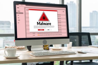 Cyber attacking concept. Malware alert showing on computer screen display scam and threat detection on computer system or online server to be removed snugly.