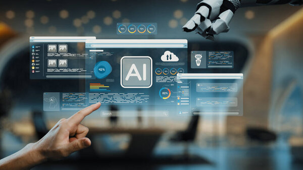 This image showcases a modern office space where advanced AI technology interfaces are displayed on transparent screens, emphasizing interaction with robotic hands. Auvana