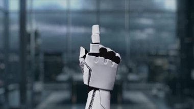 Bu video, modern çalışma alanındaki yenilik ve ileri teknolojiyi sembolize eden bir robot elle yapay zeka kavramını görsel olarak temsil etmektedir. Auvana