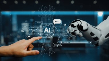 Bir insan eli, günlük hayatta yapay zeka ve teknolojinin kusursuz bütünlüğünü gösteren, gösterişli ve modern bir ofiste robotik bir kolla etkileşime girer. Auvana