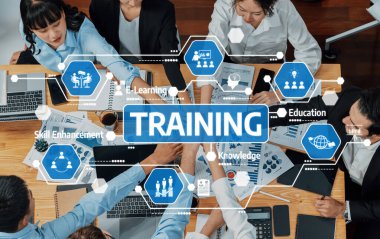 Modern teknoloji ve görsel araçlar kullanarak eğitim ve geliştirme faaliyetlerinde bulunan, canlı bir çalışma alanında takım çalışması ve işbirliği sergileyen çeşitli profesyonellerden oluşan bir grup. Dostluk