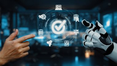 İnsan eliyle robot kol arasındaki etkileşimin büyüleyici bir temsili, dijital simgelerle dolu modern çalışma alanında teknolojik gelişmeler gösteriyor. Auvana