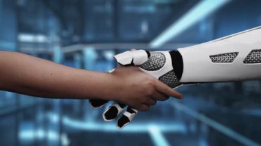 Bir insan eli, gelecekçi bir ortamda robotik bir ele uzanıyor, insanlar ve gelişmiş teknolojiler arasındaki işbirliğini ve bağlantıyı simgeliyor. Auvana