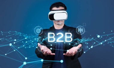 İş adamı B2B peyzajında geziniyor, iş-iş bağlantılarını geliştirmek için kullanım teknolojisi kullanıyor. B2B etkileşimlerini yeniden şekillendirir, iş-iş stratejilerinde yenilikleri teşvik eder. FaaS