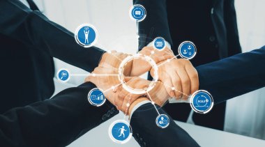 Ofis çalışanlarının el ele dizilmesi başarılı bir iş ortaklığı grubunu ve panoramik pankartta kamu işyerinde güçlü bir birlik takım çalışmasını sembolize ediyor. Kurnaz Dostluk